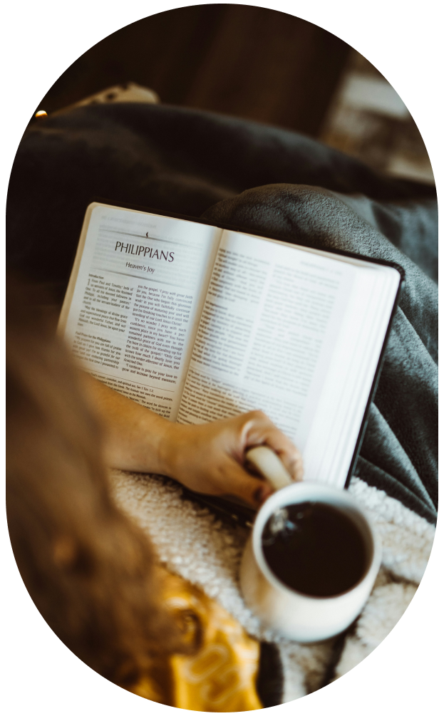 Image of a student reading the Bible